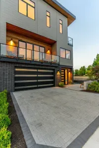 The home shines at night with a plethora of windows and stylish exterior lighting