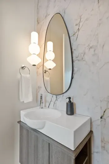 This powder bath packs in a design punch! You can find this bathroom right around the corner from the main living area.