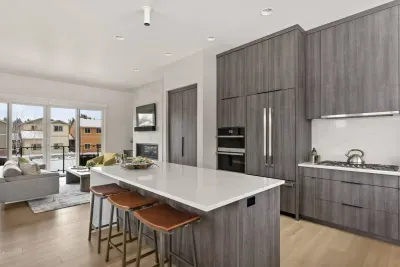 The full kitchen has high end integrated appliances and is fully stocked with all of the creature comforts of home.