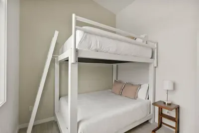 Third Bedroom: Yes, those are QUEEN bunk beds and are meant for adults! Each level holds up to 2,000lbs in weight! A nearby office work space is perfect as a second office space.