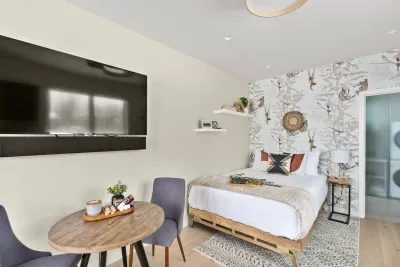 Queen bed with luxurious linens. This wall mounted smartTV can be pulled forward and turned to face the bed to watch your favorite shows in comfort!