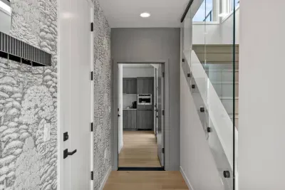 First floor views from the main foyer into the lock off studio. This space will be open when renting the whole property to give you and your guests a fourth bedroom + kitchen + ensuite bath + laundry!