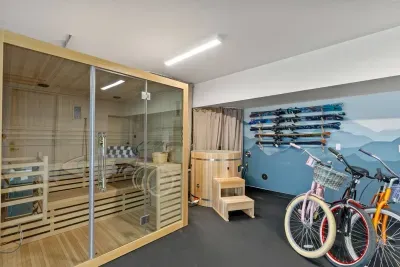 A considerable amount of love was put into this fun  and relaxing wellness center: sauna, cold plunge, 4 cruiser bikes, treadmill, free weights and bench, 2 paddleboards, universal tesla charger, bluetooth speaker, yoga mats, and ski racks