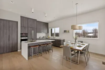 This dining and kitchen space is an entertainer's dream - plenty to room to spread out, cook delicious food, and share stories