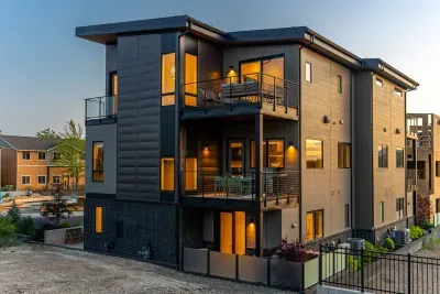 View from behind the property capturing 3 of the 4 decks the home offers!