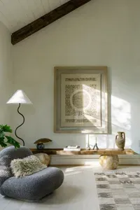 Sunlit designer nook with vaulted ceilings and cozy lounge seating