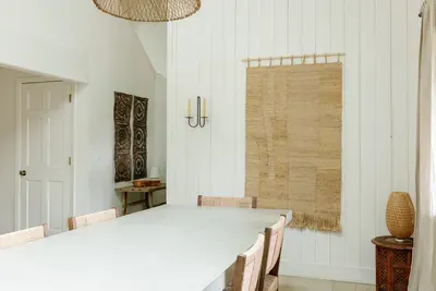 Bright, airy dining space with vaulted ceilings and warm natural textures