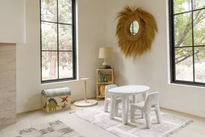 Bright kids’ nook with tree views, natural light, and charming decor