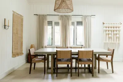 Bright, stylish dining room with seating for six and warm natural textures