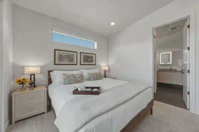 Bright king bedroom with en-suite bath and modern, relaxing design