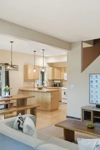 Bright open-concept kitchen and living area with island seating