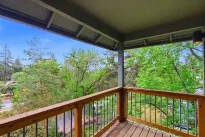 Covered balcony with tranquil treetop views and a peaceful outdoor retreat