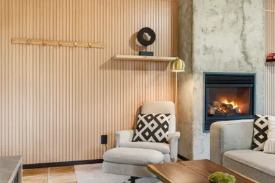 Cozy modern lounge with fireplace and stylish, comfortable seating