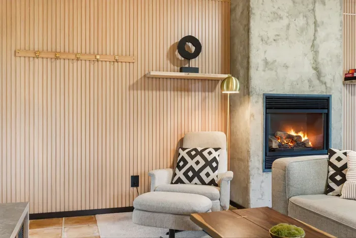 Cozy modern lounge with fireplace and stylish, comfortable seating