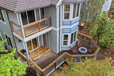 Private multi-level decks with porch swing and cozy fire pit patio