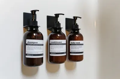 Hotel-style wall-mounted bath amenities for a clean, modern stay