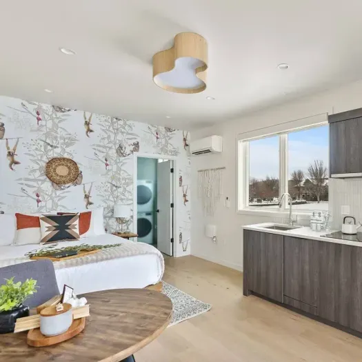 This studio is stylish and comfortable! Open to the kitchenette and dining/work area. Private bathroom and large closet space connected to this space as well. 