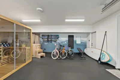 Private sauna, bikes, and fitness space for active, relaxing stays