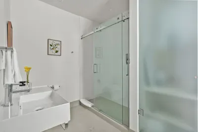 Bright spa-like bathroom with sleek walk-in glass shower