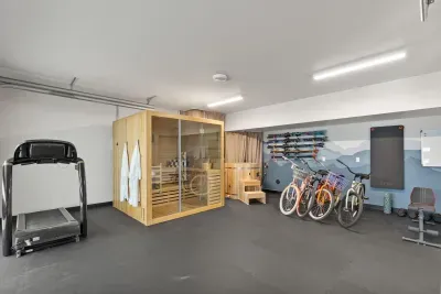 Private gym and sauna with bikes, skis, and space to unwind
