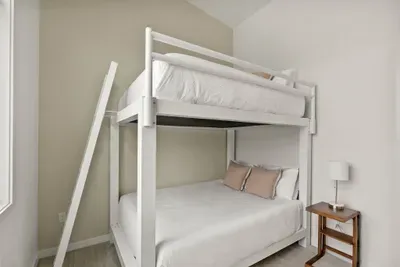 Bright bunk room with high ceilings and flexible sleeping space