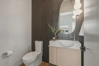 Modern powder room with designer lighting and sleek vanity