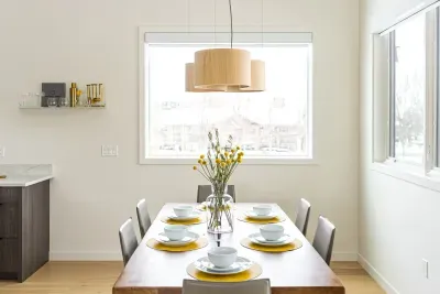 Bright modern dining space for six with large windows and stylish decor