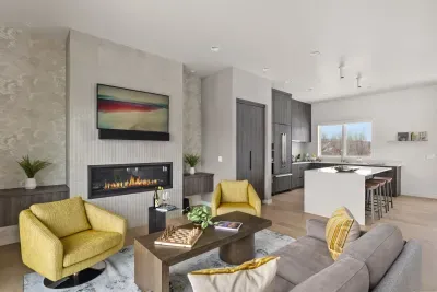 Bright modern living room with fireplace and sleek kitchen island