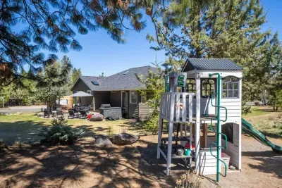 Kids' play structure nearby provides hours of play for young ones