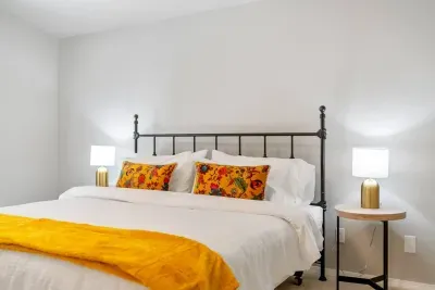 King bed in primary suite; soft sheets atop new memory foam mattress