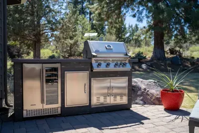 BBQ station with natural gas grill, beverage fridge, and storage