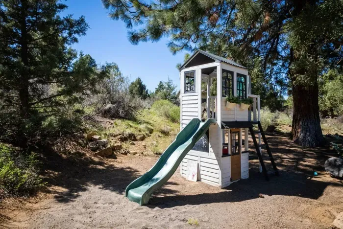 This play structure has a play BBQ and toys for endless amount of imaginary play!