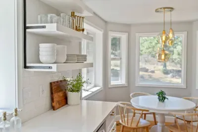 Modern kitchen stocked with all of the necessities to make a meal and entertain