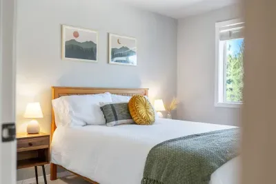 A second bedroom has a new queen bed with memory foam mattress. There is a hamper and luggage rack in the closet.