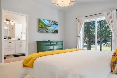 A third Smart TV can be found this room; the primary bathroom is private and spacious