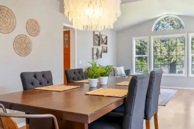 Dining room with comfy seating for 6; grab a couple more chairs nearby to squeeze in 8!