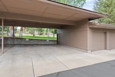 Private covered parking spot to the right labeled for Villa #6