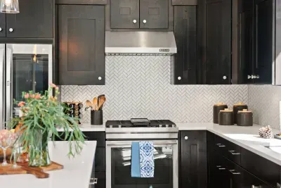 Full kitchen with quartz countertops, open to living and dining areas, island seating for 5. Kitchen is stocked with coffee, coffee maker (drip), basic seasonings, pots, pans, serveware, dishes, utensils, and kitchen appliances small and large!