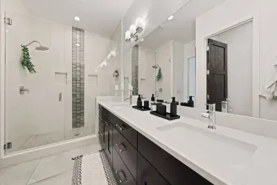 Bathroom 1: Primary En suite bathroom with dual sink vanities, large walk in shower with seating, and private toilet room with TODO bidet toilet. Bathrooms come with all soaps (hair, body, hand), towels and bathmats, and hair dryer.