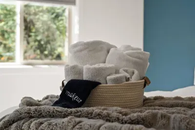 Bedroom 1: Downstairs King Suite - large room with Temper-Pedic king mattress, smartTV, door to patio, private bathroom + linen closet to store belongings. Bedrooms come with privacy shades, all bed linens and pillows, and extra blankets and pillows.