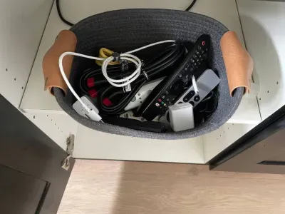 Extra cords, bricks, remotes under the TV in the family room. Please leave them for the next guests :)