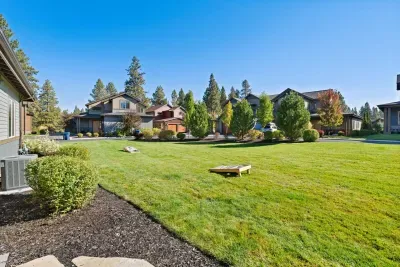 Yard: expansive, grassy, flat yard with access off of back patio and side door from main living area. Plenty of room for corn hole (provided on site) or to throw around the ball! Please note this is an unfenced yard.