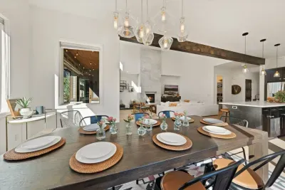 Dining area can sit up to 10 adults. Surrounded by windows and connects to the kitchen and living areas. Perfect for entertaining!