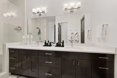 Bathroom 1: Primary En suite bathroom with dual sink vanities, large walk in shower with seating, and private toilet room with TODO bidet toilet. Bathrooms come with all soaps (hair, body, hand), towels and bathmats, and hair dryer.