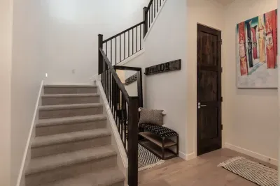 Drop zone! Shoes off keeps our home nice for all guests! Closet under the stairs is home to pack n play, play mat, and a good overflow coat closet.