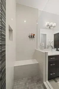 Bathroom 1: Primary En suite bathroom with dual sink vanities, large walk in shower with seating, and private toilet room with TODO bidet toilet. Bathrooms come with all soaps (hair, body, hand), towels and bathmats, and hair dryer.