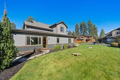 Yard: expansive, grassy, flat yard with access off of back patio and side door from main living area. Plenty of room for corn hole (provided on site) or to throw around the ball! Please note this is an unfenced yard.