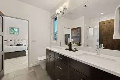 Bathroom 3: Shared between two upstairs queen bedrooms, it is connected in a jack n' jill style layout. Includes dual sink vanities, tub/shower combo, and toilet. Bathrooms come with towels and bathmats, soaps (hair, body, hand), and hair dryer.