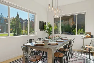 Dining area can sit up to 10 adults. Surrounded by windows and connects to the kitchen and living areas. Perfect for entertaining!