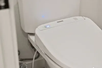 Bathroom 2: Private ensuite bathroom to upstairs king bedroom. Includes walk in shower, bidet toilet, single sink vanity. Bathrooms come with soaps (hair, body, hand), hair dryer, towels and bathmats.